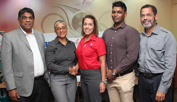 LAUNCH: From 2nd left, Dianne Henderson, chairperson of TTIM shakes hands with Kiss baking representative Sarah Jones as Diabetes Association vice president Andrew Dhanoo, Francis William Smith, director at TTIM, and at left, Tony Harford TTIM member looks on during the launch of the 2018 TT International Marathon at Olympic House, Port of Spain.