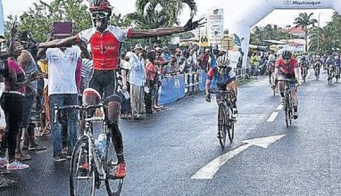 T&T cyclist Teneil Campell celebrates after crossing the finish line to win the Elite Women Caribbean Road Race on Saturday in Martinique. Yesterday Campbell successfully defender her title in the Individual Time Trial to become the first woman to ever achieve the Caribbean double.