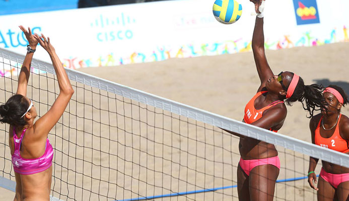 TT’s Ayanna Dyette, second from right, competes at the 2015 Pan Am Games alongside partner Malika Davidson, right, against Mexico in Toronto, Canada.