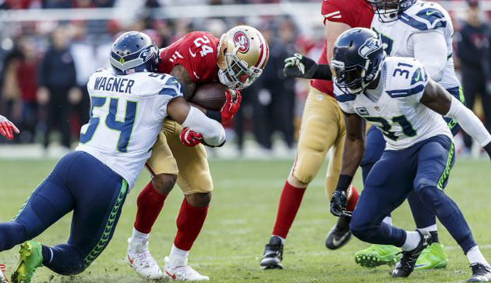 Hitting his man: Seattle Seahawks linebacker Bobby Wagner makes a play against San Francisco   Read more at https://www.rugbyworld.com/news/rugby-nfl-exchange-ideas-93441#FbK0Pb2ixuxKte1H.99