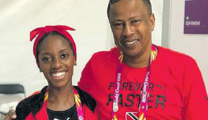 T&T’s top international distance runner Tonya Nero and national distance coach Dexter Voisin after she placed 14th in the Commonwealth Games women’s marathon in Gold Coast, Australia, yesterday. She clocked 2.55.14.