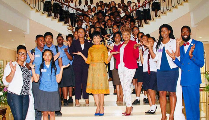 Sharon Rowley, wife of Prime Minister Dr Keith Rowley, celebrates International Women's Day with students, government ministers and "influencers" yesterday at the Diplomatic Centre, St Ann's. The theme of this year's celebration was "Balance for Better" PHOTO Courtesty the Office of the Prime Minister
