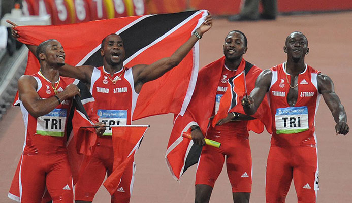 In this file photo, (from L) TT's Keston Bledman, Emmanuel Callender, Richard Thompson and Marc Burns celebrate after winning silver in the men's 4×100m relay final at the National Stadium during the 2008 Beijing Olympic Games on August 22, 2008.