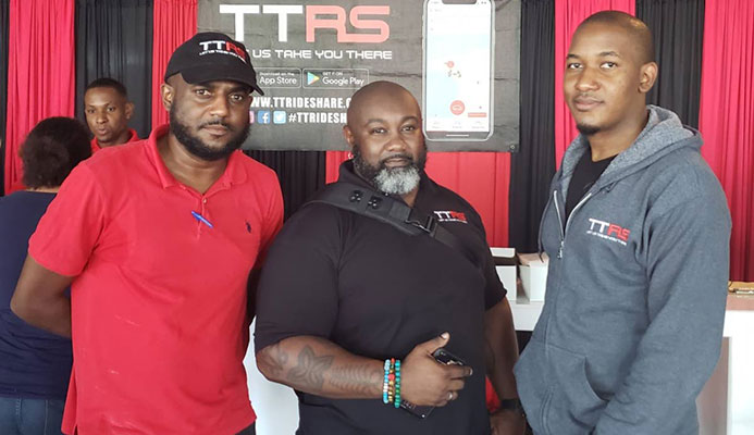 TTRideShare directors (from left) Gerrard Small, Jadon LaCroix and Dwight Housand at Gulf City Mall, Lowlands.