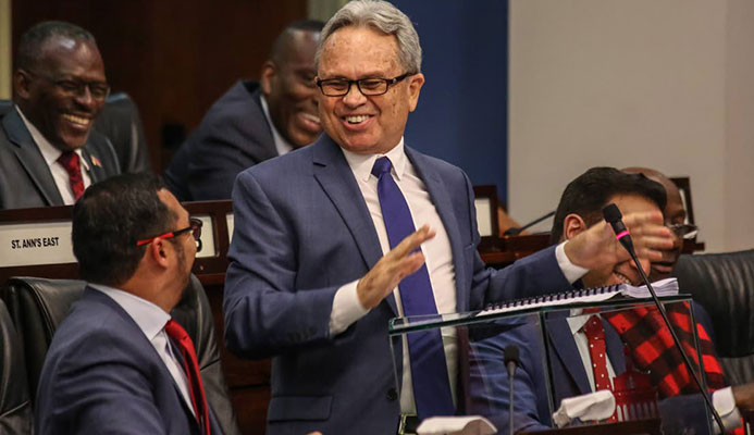 Minister of Finance Colm Imbert smiles during his presentation of the National Budget,yesterday,in Parliament.