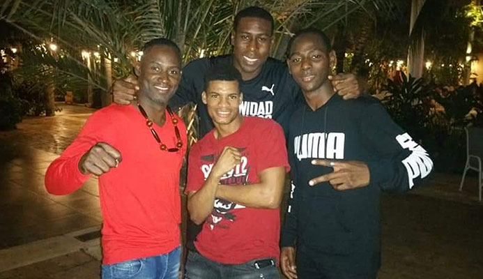 Qualifiers……T&T boxers Aaron Prince, left, Nigel Paul, back/centre, Tyron Thomas, right and Michael Alexander, front/centre, pose for a photo after qualifying for the Pan Am Games last week