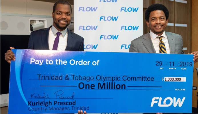 Flow country manager Kurleigh Prescod, left, presents the symbolic $1 million cheque to TTOC president Brian Lewis.