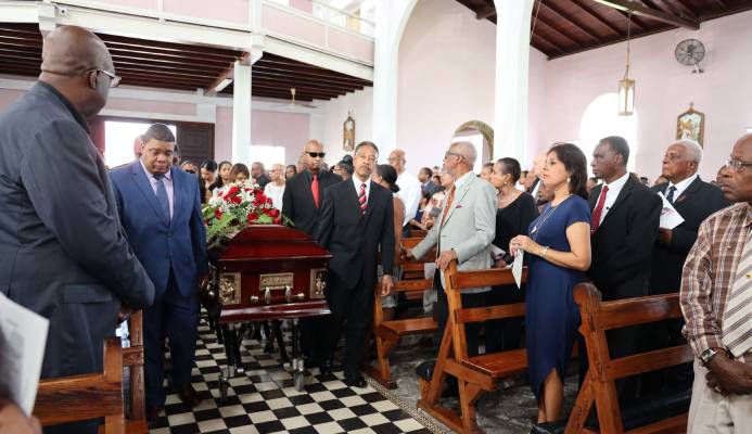 Gerard Tim Kee, left, was among the pallbearers who carried his father's casket into the church during his funeral service at St Theresa’s Roman Catholic Church yesterday.