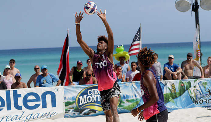 T&T’s Daynte Stewart, right, sets up a pass for team-mate Marlon ‘Waldo’ Phillip during one of their matches on the  fourth stop of the 2019 NORCECA Beach Circuit  in the sands adjacent to the Barceló Solymar Hotel, Varadero, Cuba in May. Photo: NORCECA.