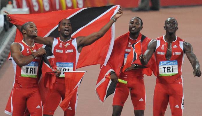 In this 2008 file photo, TT's Keston Bledman, Emmanuel Callender, Richard Thompson and Marc Burns celebrate after winning silver in the men's 4×100m relay final during the 2008 Beijing Olympic Games. AFP PHOTO -