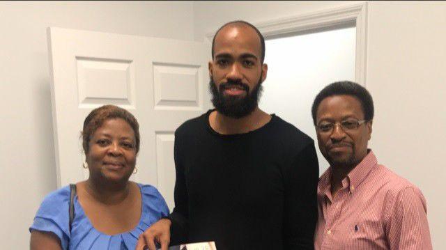 FAMILY TIME: Machel Cedenio, centre, poses for a photo with his proud parents, Diane, left, and Hayden.