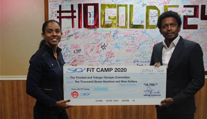 Fitness Instructor Extraordinaire Simone Gonzales of the Fitness Center Ltd delivers proceeds from her recently concluded Fitness Camp, to TTOC president, Mr. Brian Lewis.