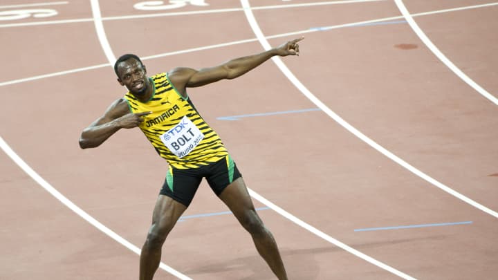 Usain Bolt of Jamaica celebrates after winning gold in the Men's 100 metres final during day two of the 15th IAAF World Athletics Championships Beijing 2015 at Beijing National Stadium on August 23, 2015 in Beijing, China. VCG | Visual China Group | Getty Images