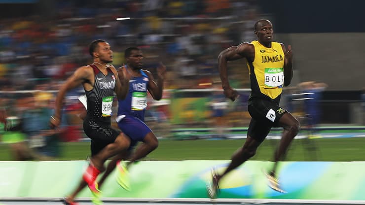 Andre de Grasse of Canada and Usain Bolt of Jamaica react as they compete in the Men’s 200m Semifinals on Day 12 of the Rio 2016 Olympic Games at the Olympic Stadium on August 17, 2016 in Rio de Janeiro, Brazil. (Photo by Ian MacNi/Getty Images)Ian MacNicol | Getty Images Sport | Getty Images