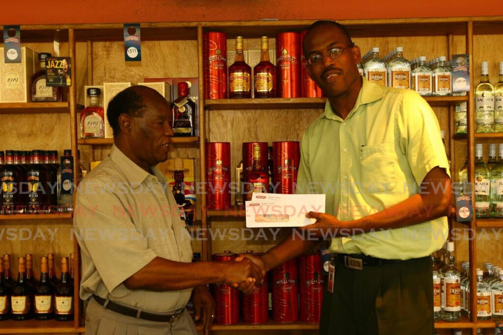 FILE: In 2008, veteran sport journalist George Baptiste, received an award from Angostura for an article on the Royal Oak Derby event at the Arima Racing Club, Santa Rosa Arima.