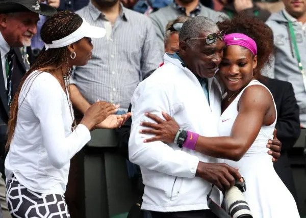 Serena Williams (R) of the USA celebrates with her father Richard Williams and sister Venus Williams after her Ladies’ Singles final match against Agnieszka Radwanska of Poland on day twelve of the Wimbledon Lawn Tennis Championships at the All England Lawn Tennis and Croquet Club on July 7, 2012 in London, England. (Photo by Julian Finney/Getty Images)