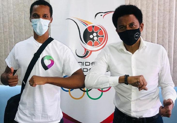 IN THE INTEREST OF SPORT: LUHU app co-founder Zwede Hewitt, left, and Trinidad and Tobago Olympic Committee (TTOC) president Brian Lewis celebrate the TTOC/LUHU partnership at the TTOC headquarters, Abercromby Street, Port of Spain, recently.