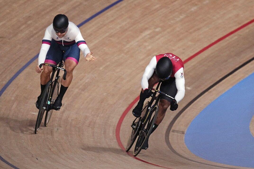 PREMATURE CONCESSION: Denis Dmitriev of the Russian Olympic Committee, left, acknowledges a win for Team TTO’s Nicholas Paul after the second ride-off in their best-of-three sprint quarter-final at the 2020 Summer Olympics, yesterday, in Izu, Japan. Soon, however, the track judges would penalise Paul and give Dmitriev a reprieve.  @Caption:—Photo: AP