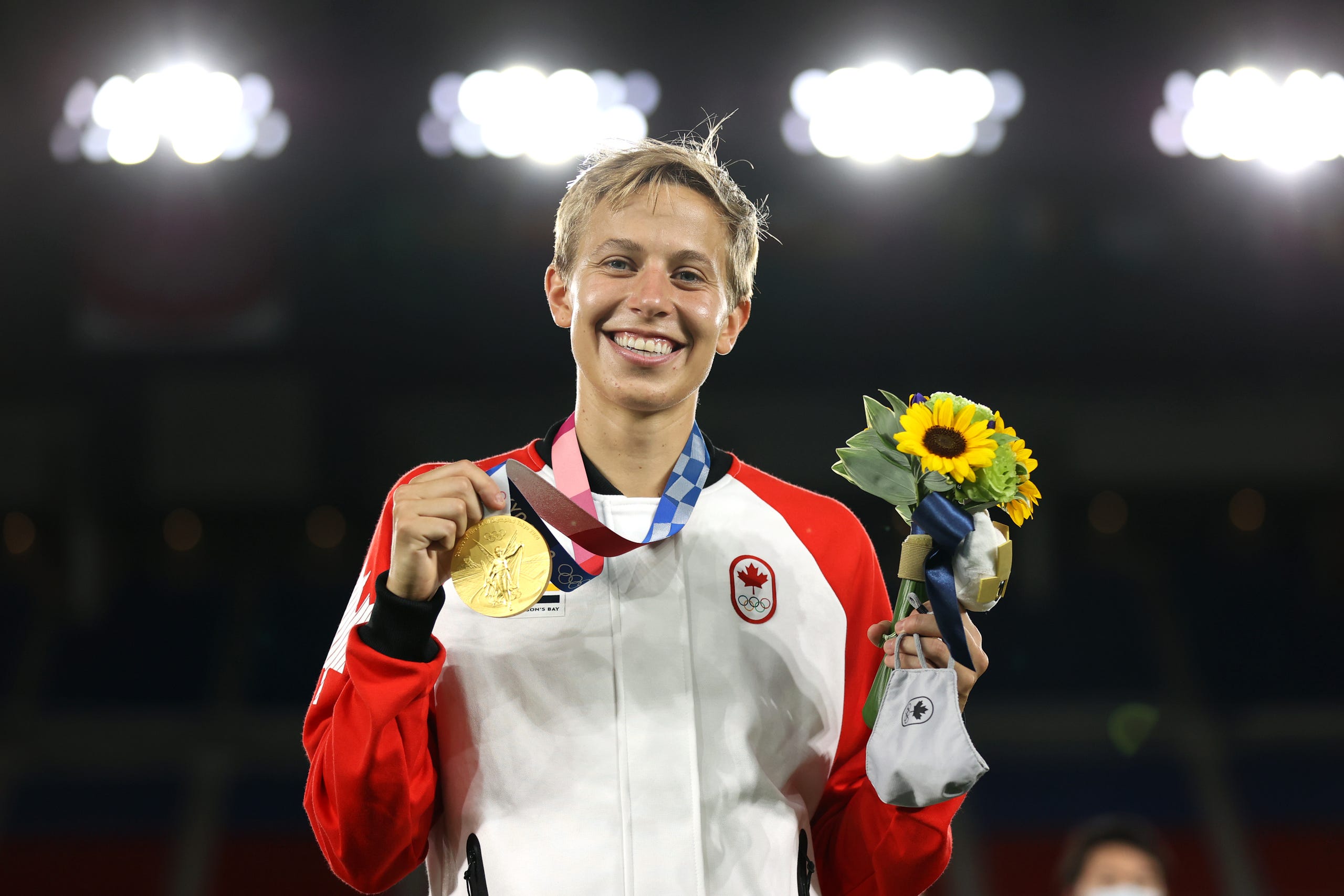 Canada midfielder Quinn on the podium after Canada won the gold medal at the Tokyo Olympics.   NAOMI BAKER, GETTY IMAGES