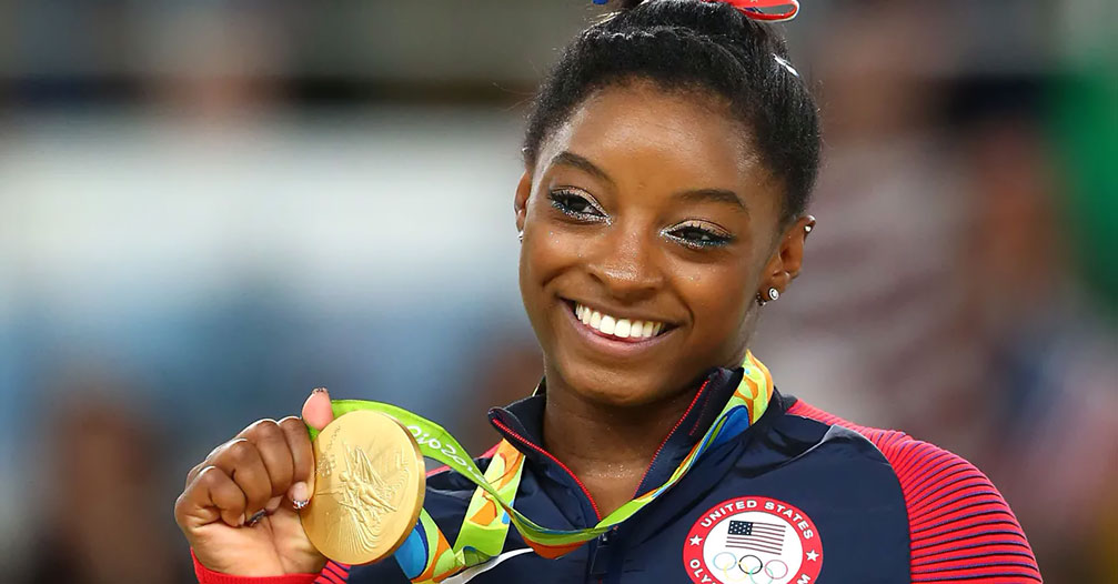 Gold medalist Simone Biles of the United States celebrates at the medal ceremony for the Women's Floor at the Rio 2016 Olympic Games 2016 Getty Images