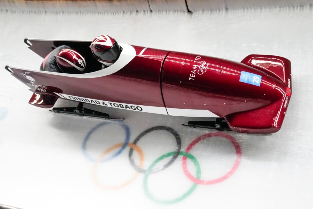 Axel Brown and Andre Marcano, of Trinidad and Tobago, compete during the two-man heat 1 at the 2022 Winter Olympics, on Monday, in the Yanqing district of Beijing. (AP Photo) -