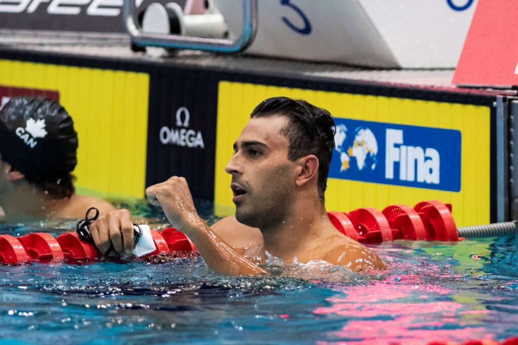 Dylan Carter of Trinidad and Tobago wins the men's 50m backstroke during the swimming world cup at Berlin, on Saturday. (AP PHOTO) - (Image obtained via: newsday.co.tt)