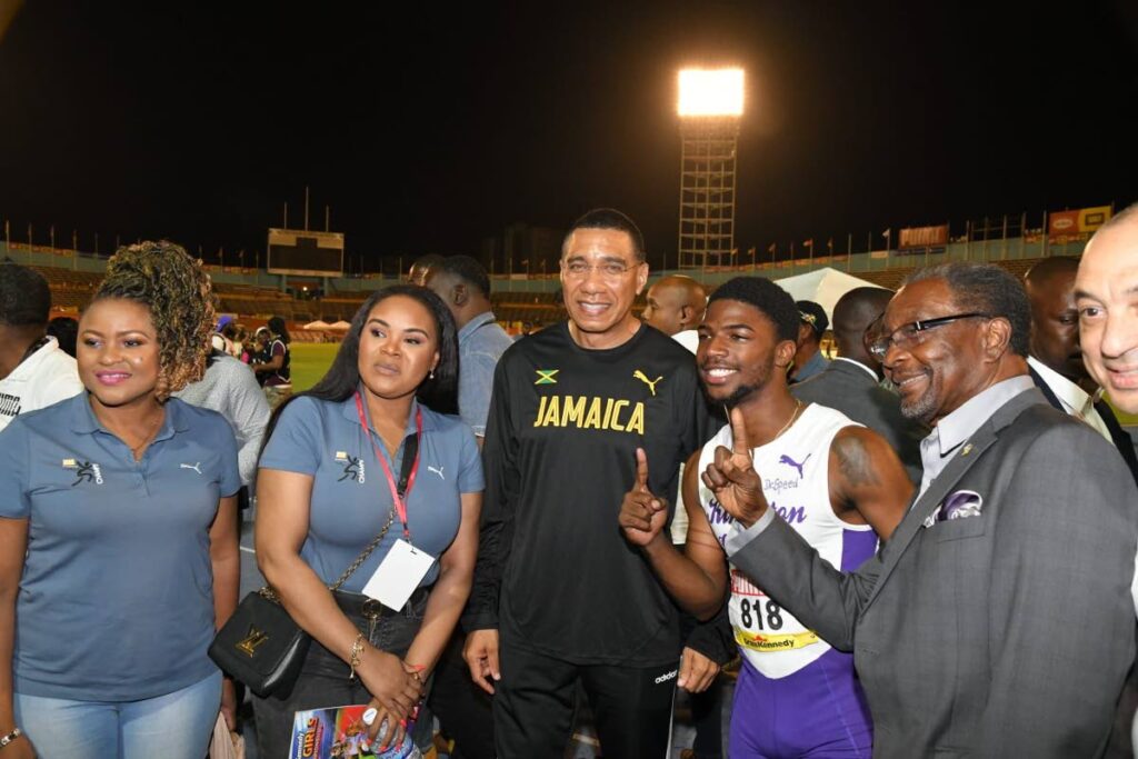 Education Minister Dr Nyan Gadsby-Dolly and Sport Minister Shamfa Cudjoe take a photo with Jamaican Prime Minister Andrew Holness (centre), Kingston College sprinter Bouwahjie Nkrumie, US ambassador to Jamaica Nick Perry and CEO of GraceKennedy Ltd Don Wehby. - Andrew Holness's Facebook page (The TTOC obtained this image from newsday.co.tt)