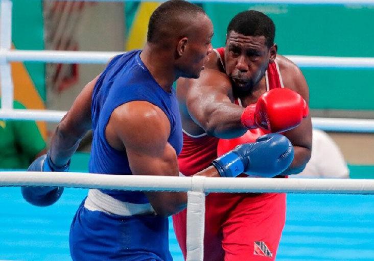 COMBAT: Team TTO’s Nigel Paul throws a right cross against Colombia’s Cristian Salcedo in their 92kg+ super heavyweight preliminary bout, during the 2023 Pan American Games at the Centre de Entrenamiento Olímpico, in Santiago, Chile, yesterday.  —Photo courtesy Photosport/Panam Sports (Image obtained at trinidadexpress.com)