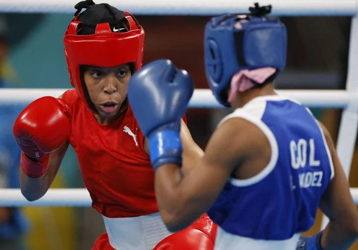 GUY EXITS: Tianna Guy, left, of Trinidad and Tobago sizes up her opponent, Angie Valdez of Colombia, during their women’s 60 kg fight at the Centro de Entrenamiento Olímpico, yesterday, as the Santiago 2023 Pan American Games continued in Santiago, Chile. Guy lost 0-5. —Photo courtesy  Photosport/Panam Sports (Image obtained at trinidadexpress.com)