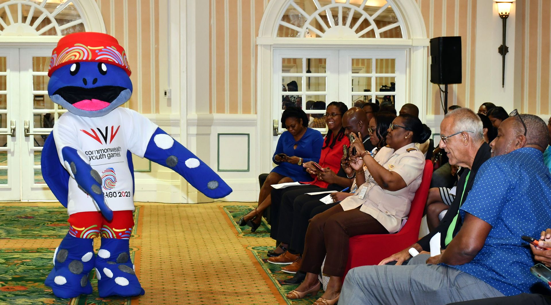 The 2023 Commonwealth Youth Games Mascot Cocoyea dances for the audience during a press conference at Magdalena Grand, Lowlands, Tobago on July 18, 2023.  VINDRA GOPAUL (Image obtained at guardian.co.tt)