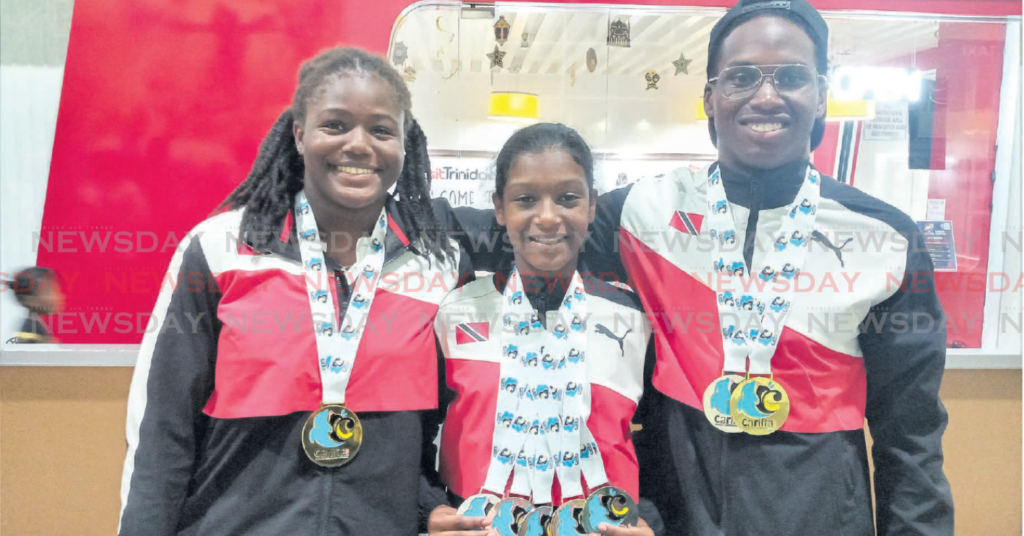 TT co-captains Amari Ash, left, and Johann-Matthew Matamoro, right, at the Piarco International Airport on Wednesday after returning from the 37th Carifta Aquatic Championships, held in Bahamas. Marena Martinez, middle, won five medals in the girls 11-12 age group. PHOTO BY JELANI BECKLES (Image obtained at newsday.co.tt)