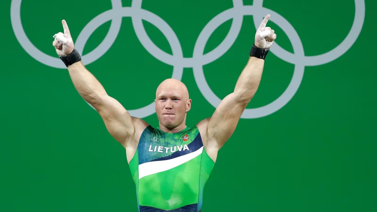 Aurimas Didzbalis, of Lithuania, celebrates after his final lift in the men's 94kg weightlifting competition at the 2016 Summer Olympics in Rio de Janeiro, Brazil, Aug. 13, 2016. (AP Photo/Mike Groll) (Image obtained at ctvnews.ca)
