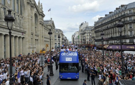 Crowds: Sports fans packed the streets of Paris to welcome home their Olympic heroes