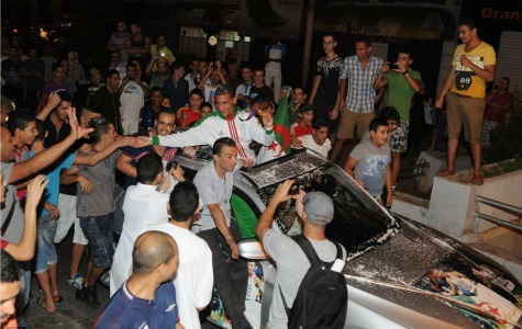 Champion: Algerian Taoufik Makhloufi, who won the gold medal in the men's 1500m final, greets fans upon his return to Algiers