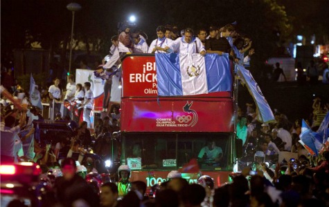 Celebrations: Crowds of fans waving flags cheered Erick Barrondo, Guatemala's first ever Olympic medal winner, during a victory parade through the streets of Guatemala City