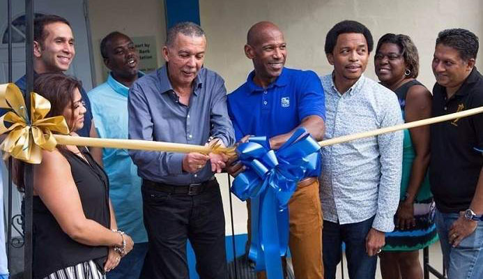 President Anthony Carmona, fourth from left, gets some assistance from RBC's managing director Darryl White, fourth from right, as he cuts the ribbon to officially open Presentation College San Fernando new squash court on Saturday. Photo: EDISON BAKER President Anthony Carmona, fourth from left, gets some assistance from RBC's managing director Darryl White, fourth from right, as he cuts the ribbon to officially open Presentation College San Fernando new squash court on Saturday. Photo: EDISON BAKER